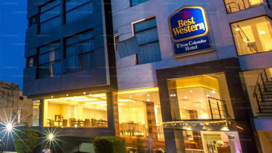 Facade of Best Western Elyon Colombo hotel at dusk, showing the sign, windows, and lighting.